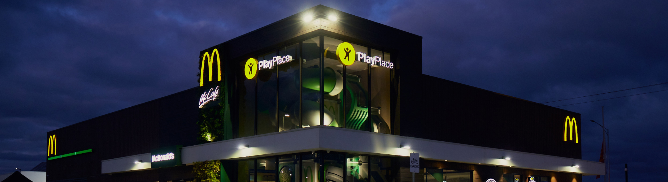 Employee holding happy meal toy