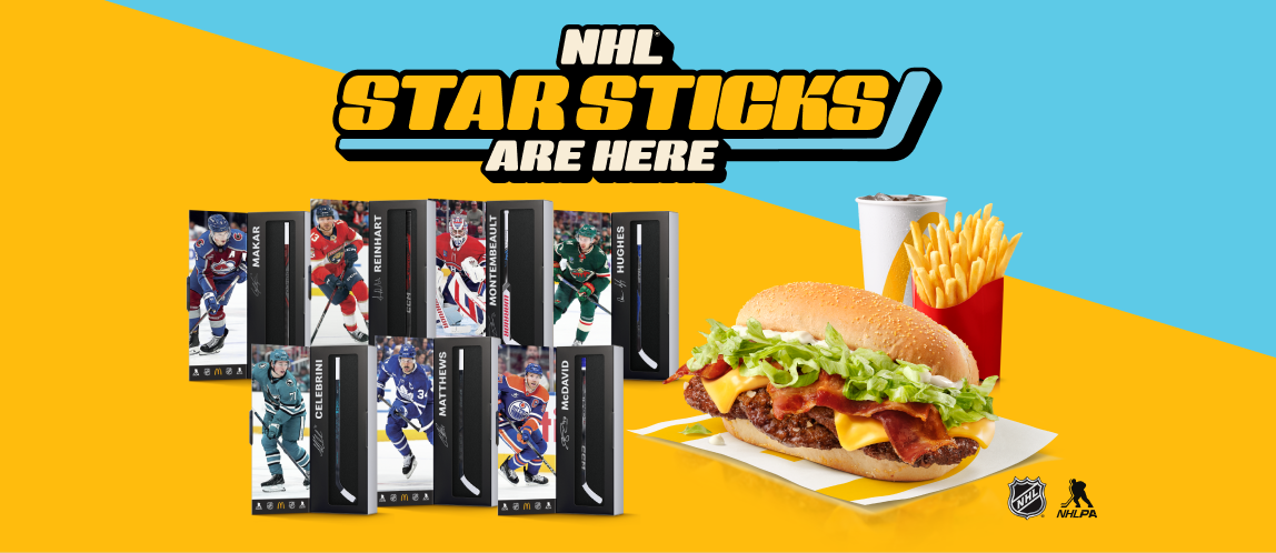 Headline: NHL® Star Sticks are here. The full collection of seven NHL Star Sticks in their packages, next to a Big Mac, medium Fries and medium fountain drink.