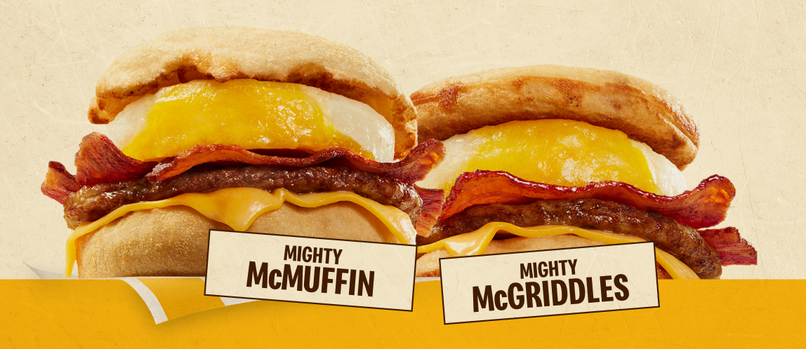 An image of two breakfast sandwiches. On the left is a Mighty McMuffin® and on the right is a Mighty McGriddles®. The below them are the labels, “Mighty McMuffin” and “Mighty McGriddles”. 