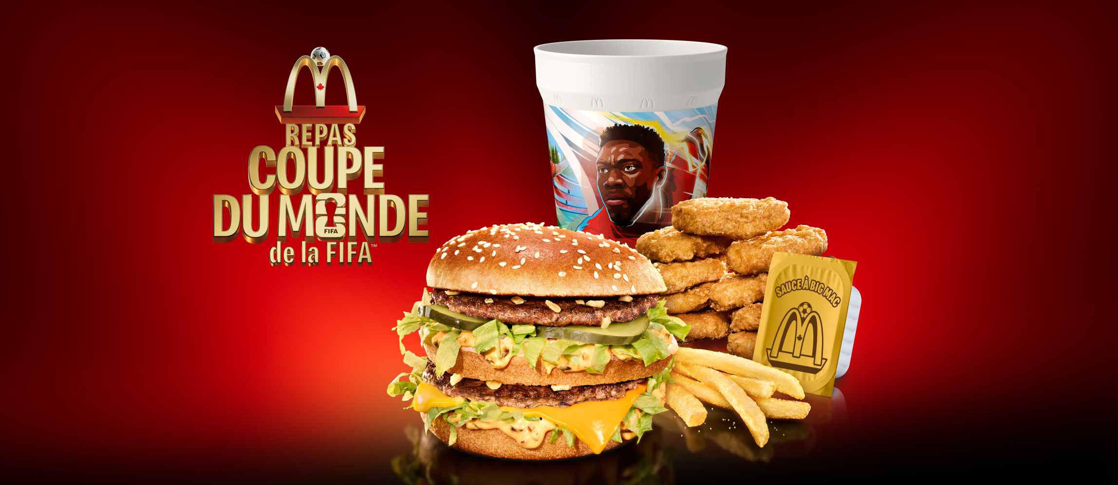 Un Big Mac®, des McCroquettesMD, une boisson et un contenant de sauce sur un fond rouge et noir ainsi que le titre « Repas Coupe du Monde de la FIFA™ ».