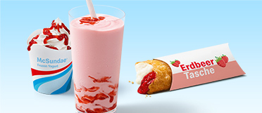 McSundae® Frozen Yogurt mit Erdbeer-Sauce, McMilchshake Erdbeer mit Erdbeer-Sauce und die heiße Erdbeer-Creamcheese Tasche