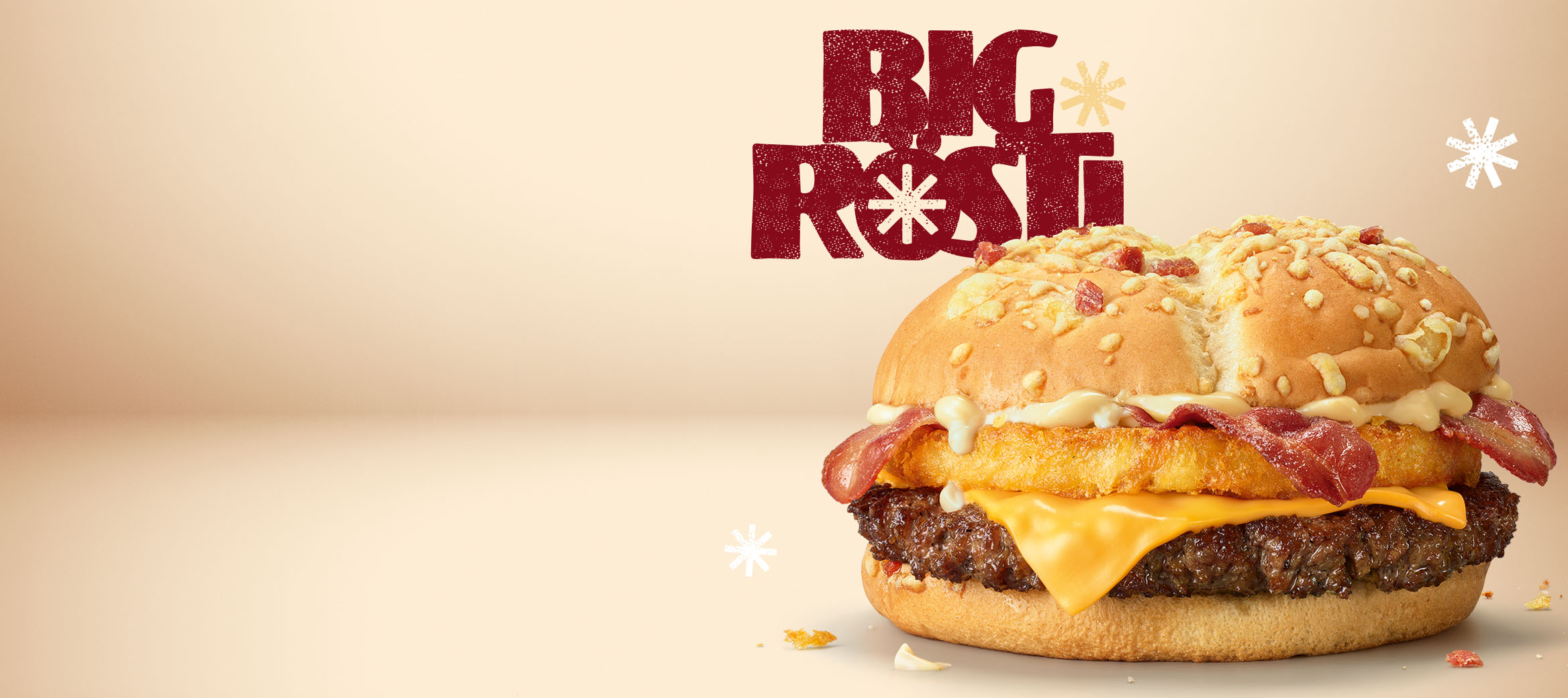 Der Big Rösti mit knusprigem Kartoffelrösti-Patty ist zu sehen. Dahinter sind der neue Big Rösti Cranberry und der Big Rösti Raclette abgebildet.
