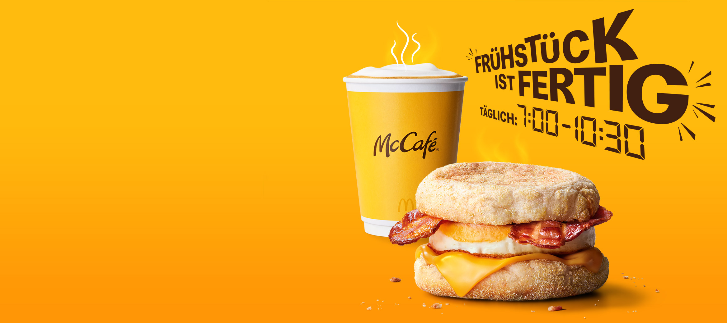 Das Bild zeigt die Überschrift „Frühstück ist fertig! Täglich von 7:00 bis 10:30 Uhr". Daneben steht ein Becher Kaffee, ein McMuffin Bacon & Egg und die Info "100% Eier aus Freilandhaltung".