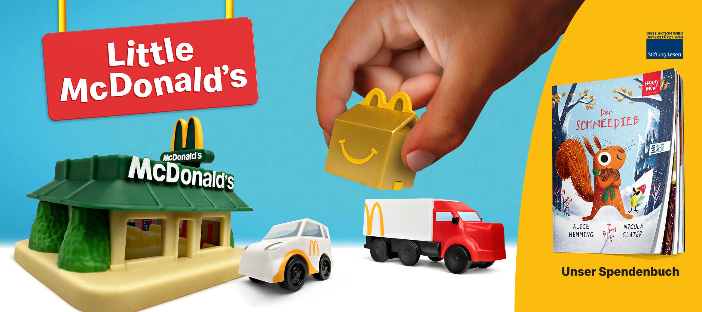 Little McDonald's Spielzeug-Set: Mini-Restaurant, Fahrzeuge, Happy Meal Box. Daneben ein Spendenbuch mit Eichhörnchen.