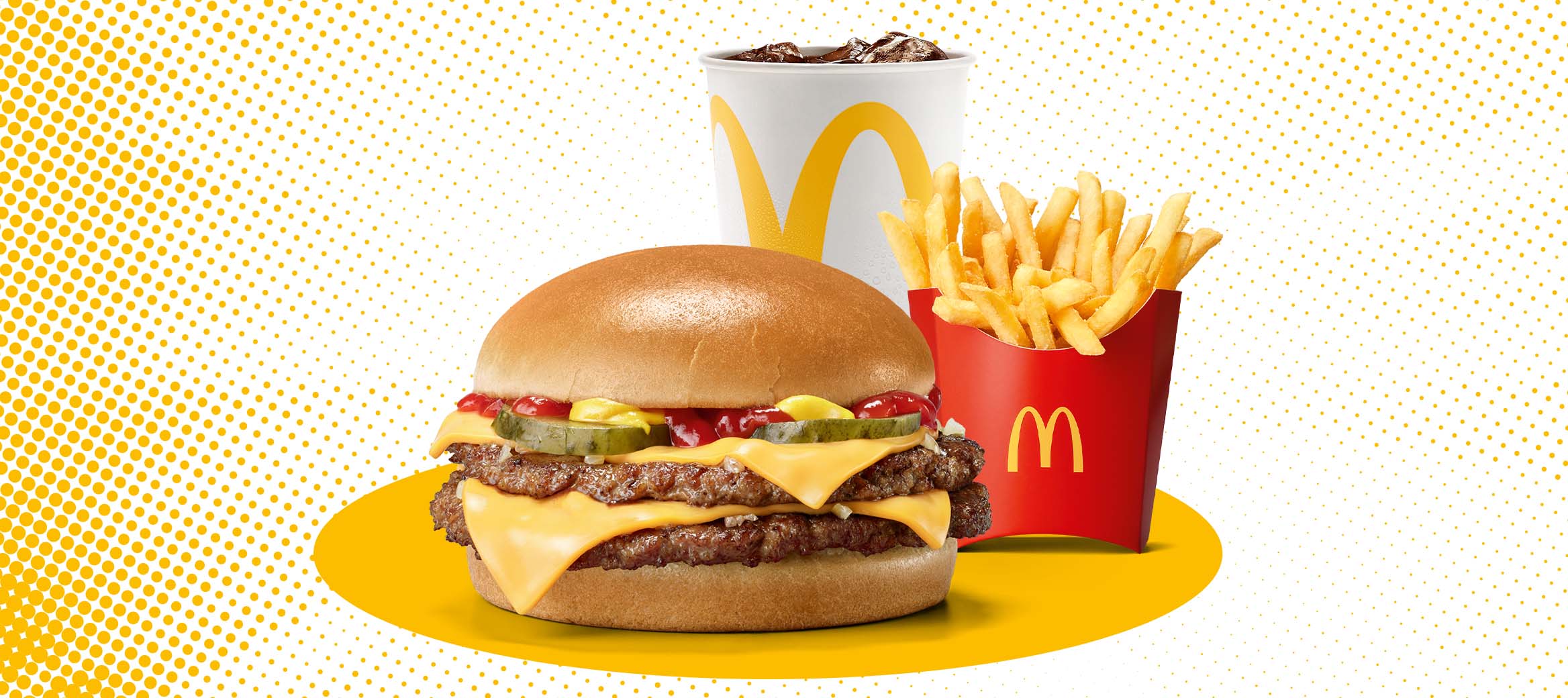 Zu sehen ist ein Double Cheeseburger mit mittleren Pommes und 0,4l Softdrink.