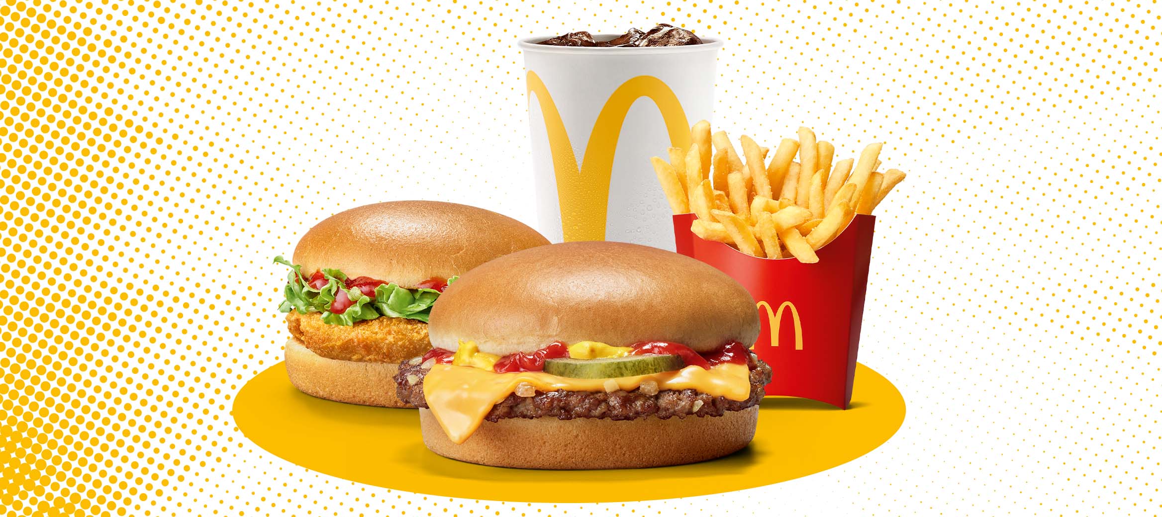 Zu sehen sind ein Chickenburger und ein Cheeseburger. mit mittleren Pommes und 0,4l Softdrink.
