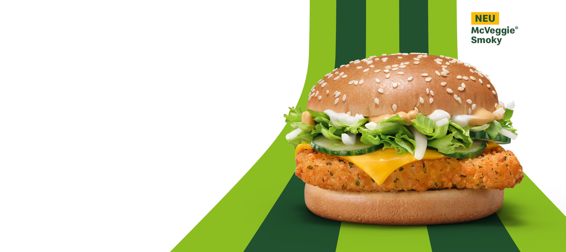McVeggie Smoky Burger mit Valess-Patty, Gurken, Zwiebeln, Eisbergsalat und rauchiger 1955®-Sauce im Sesambun.