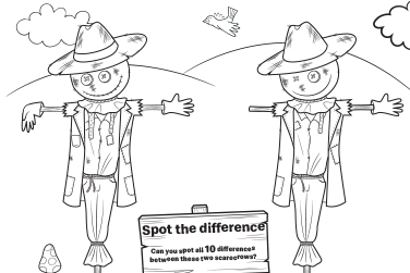 Two scarecrows on a field