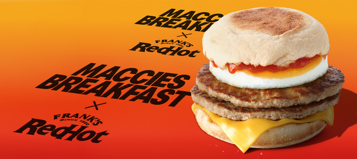 The double sausage and egg McMuffin with Franks redhot ketchup on an orange and red gradient background