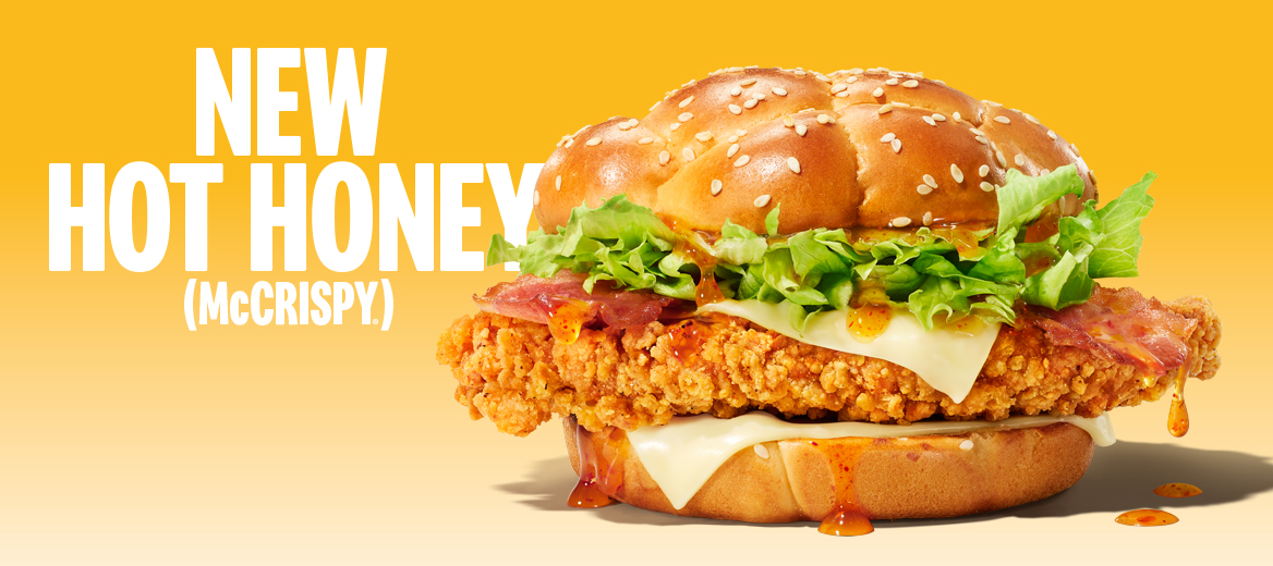 Hot Honey McCrispy burger with promotional text on a yellow grad background