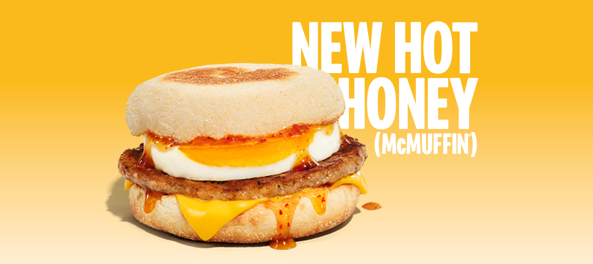 Hot Honey Sausage and Egg McMuffin featured with bold promotional text on a yellow background.