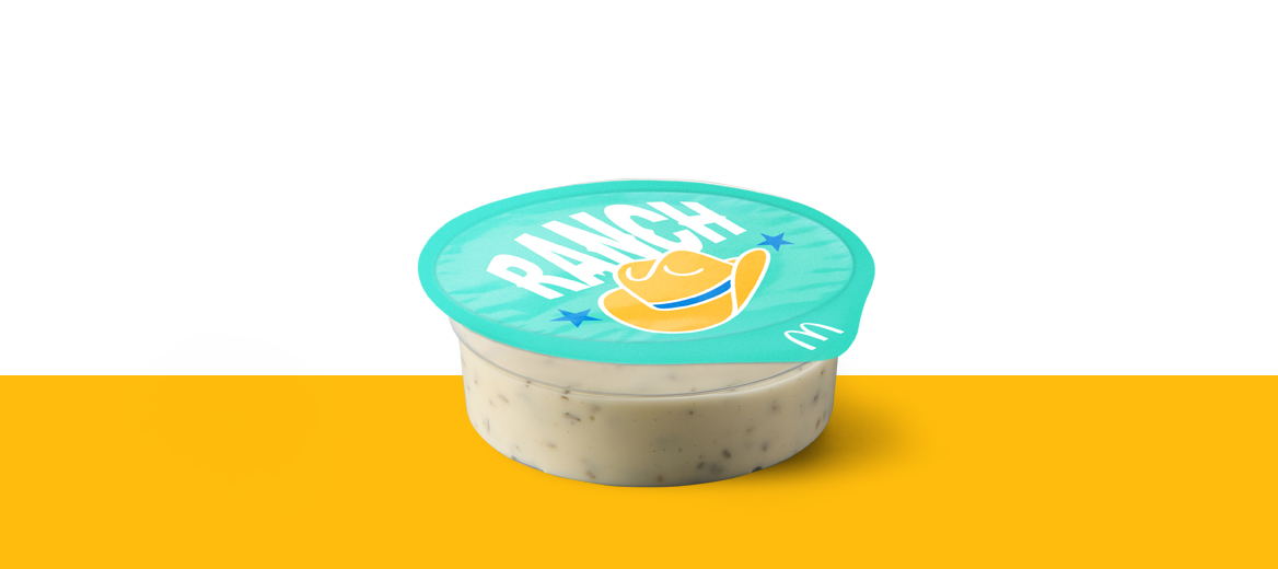 Pot of creamy Ranch dipping sauce with branded turquoise lid.