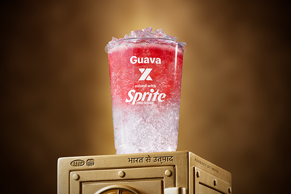 McDonald’s Guava x Sprite® Zero sits on top of a gold vault .