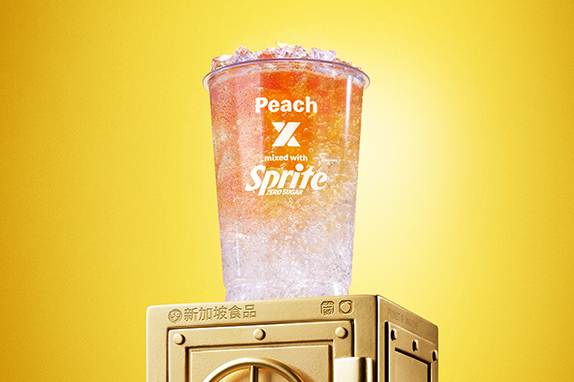 McDonald’s Peach x Sprite® Zero sits on top of a gold vault .