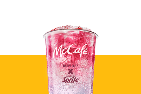 Rasperry and Sprite drink set against a yellow and white background