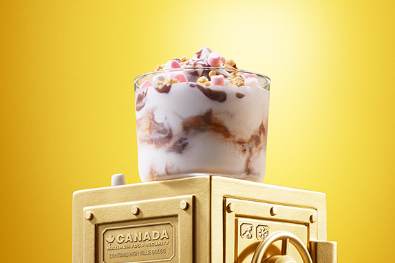 Twix® White Salted Caramel McFlurry® sits on top of a gold vault .