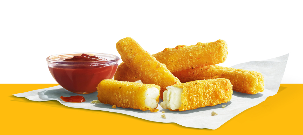 Halloumi Fries with tomato dip on a yellow shelf.