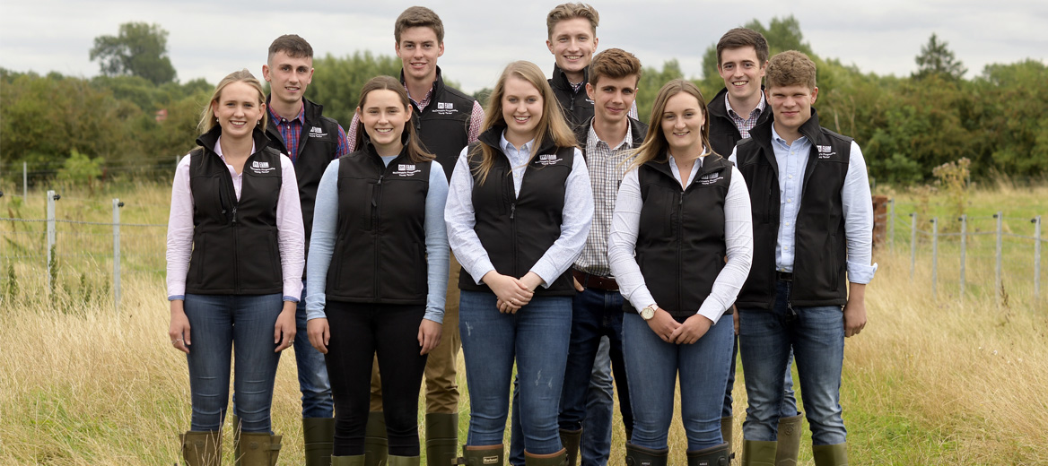 Progressive Young Farmers standing in a field