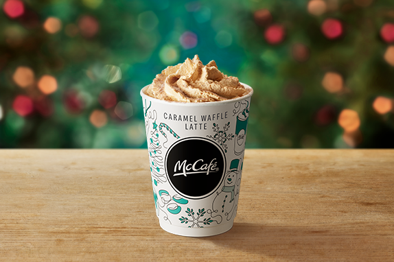 Caramel Waffle Latte on a table with a Christmas background.