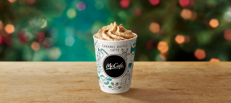 Caramel Waffe Latte on a table with a Christmas background. 