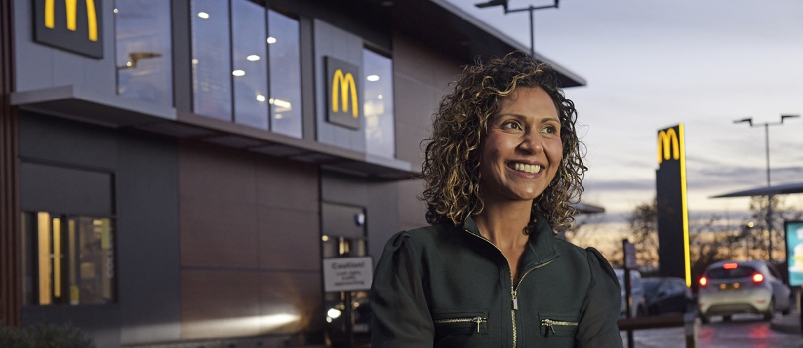 Shameela with team members outside a McDonald’s restaurant.