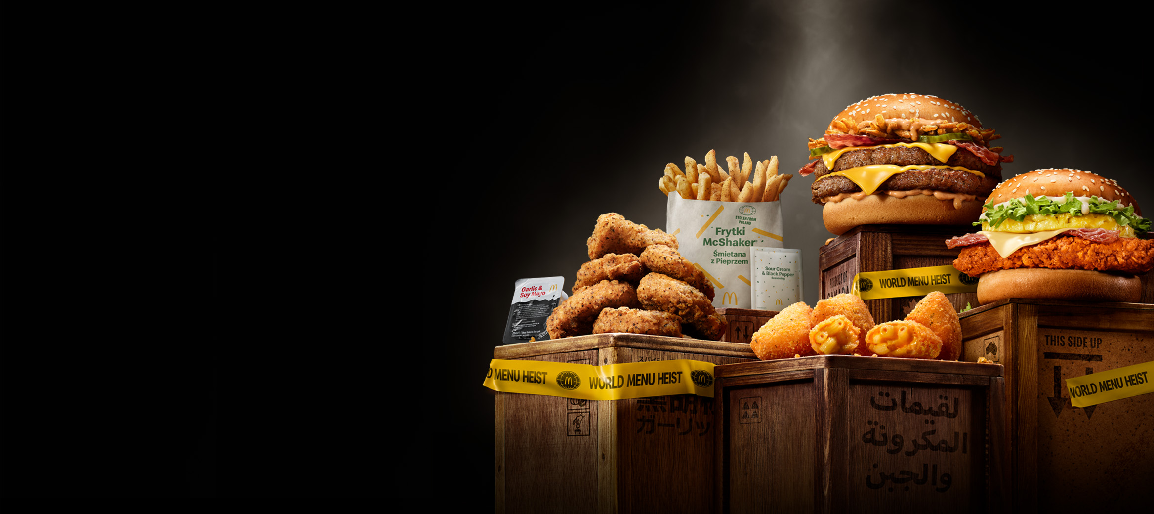 Assorted McDonald's menu items including burgers, fries, chicken nuggets, and cheese bites displayed on wooden crates with 'World Menu Heist' tape, featured against dark background.