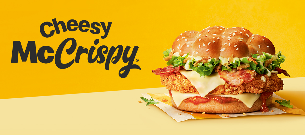 Cheesy McCrispy burger on a yellow background on a yellow shelf