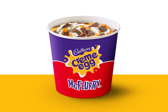 Cadbury Creme Egg McFlurry ice cream on a yellow shelf.