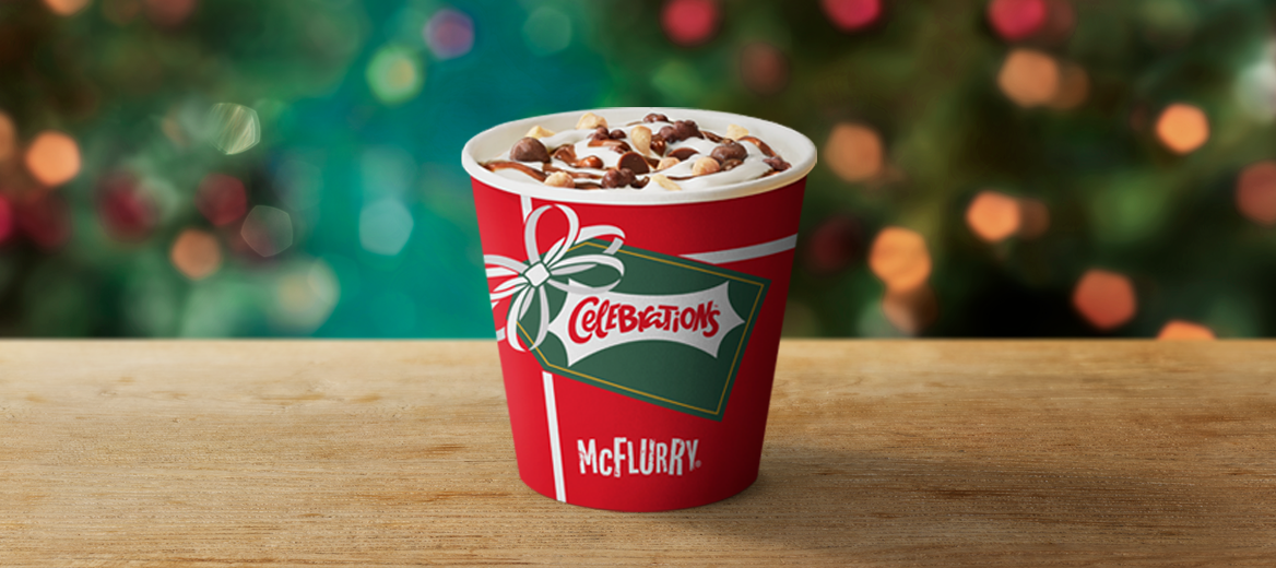 Celebrations McFlurry regular size on a table with a Christmas background.