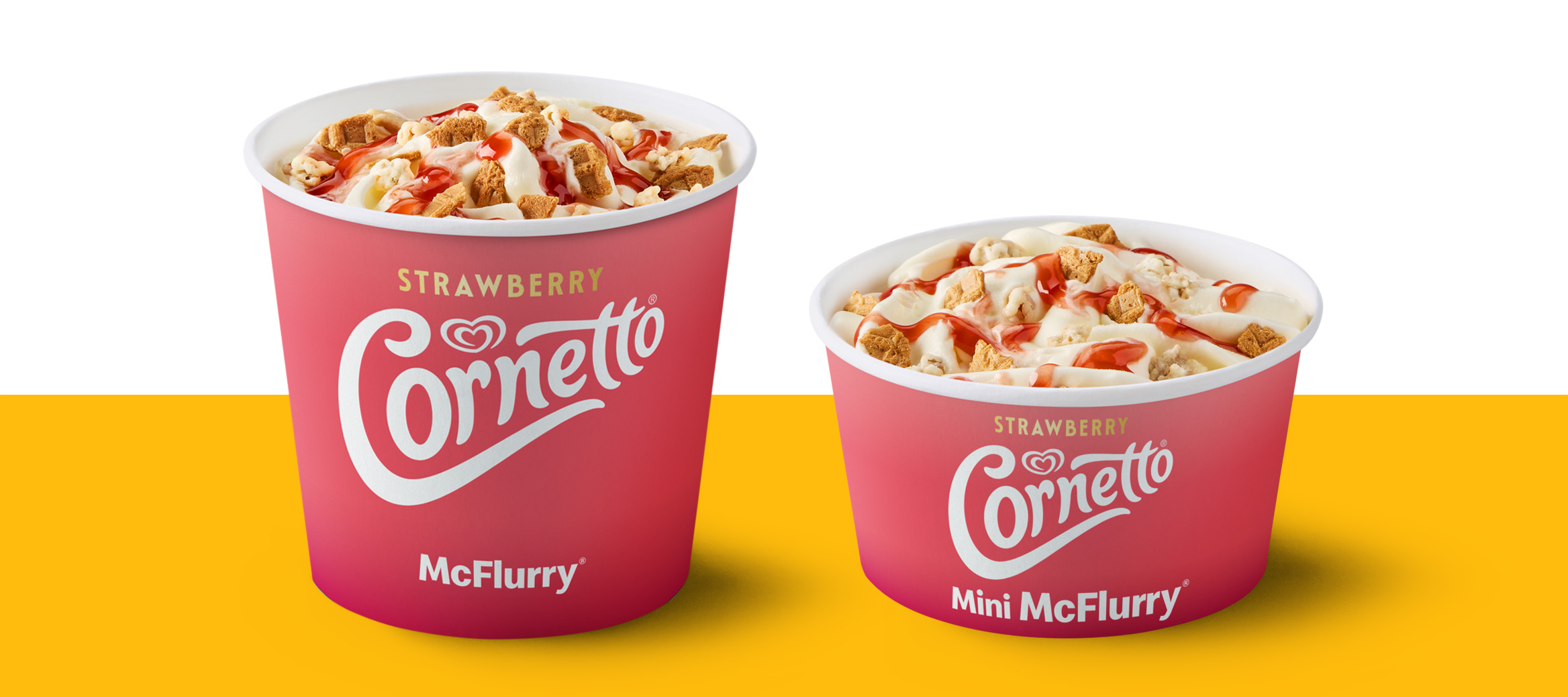 Regular and mini Strawberry Cornetto McFlurry desserts topped with biscuit pieces and strawberry sauce.