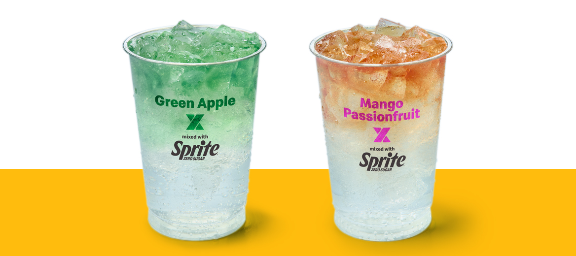 Green Apple x Sprite and Mango x Passionfruit x Sprite in a cup on a yellow shelf.