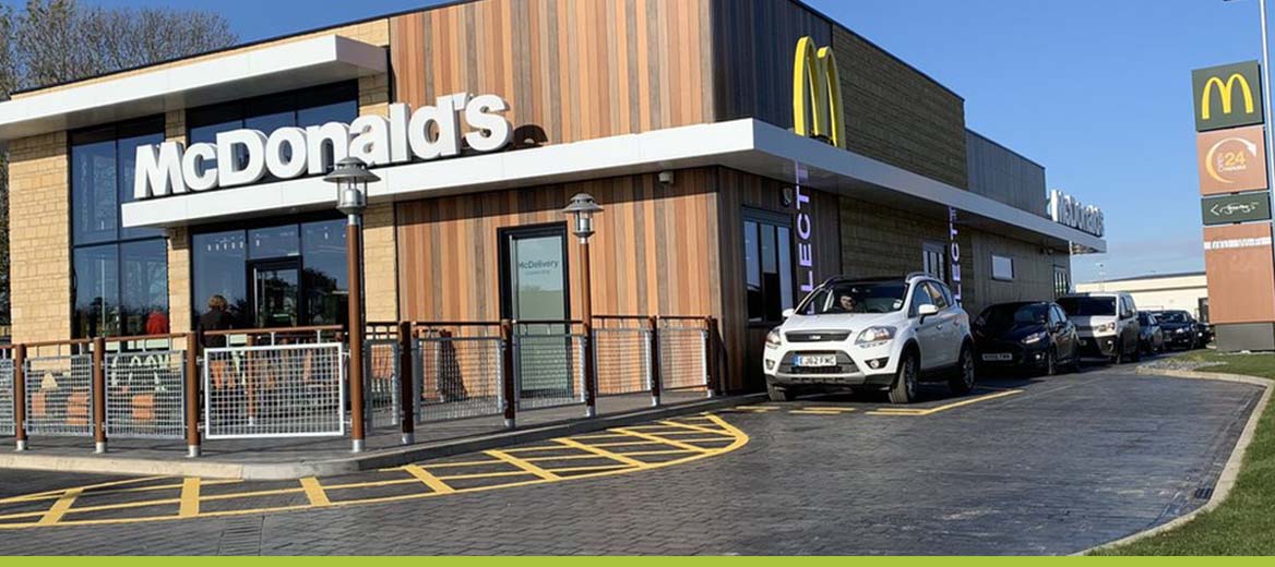 Exterior shot of McDonald's restaurant with view of drive thru.