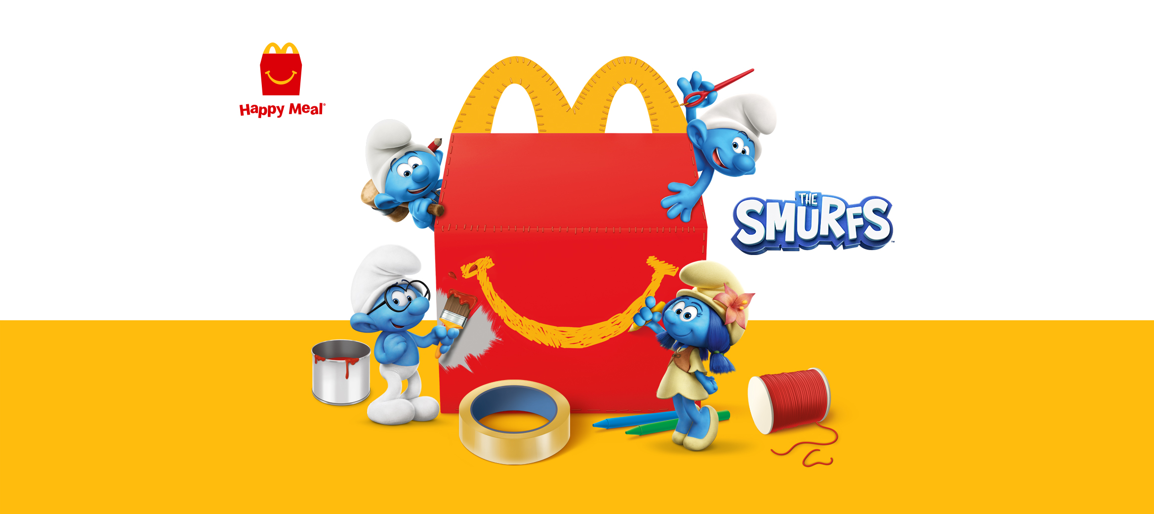  Happy Meal box with four Smurfs doing arts and crafts.